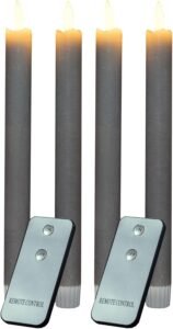Led kaarsen set 10, Een mooi gerangschikte LED-kaarsen set in een gezellige, moderne woonkamer. De kaarsen stralen een zachte, warme gloed uit en vormen de perfecte aanvulling op woonhuis accessoires en decoratie.